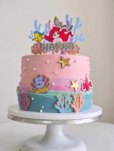 Mermaid under-the-sea birthday cake with coral, shells and pastel sea colours