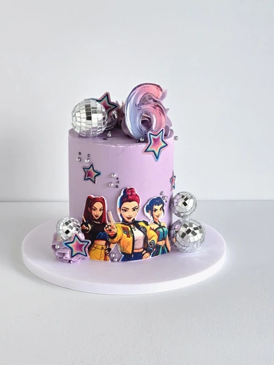 Pink pop-star themed birthday cake with disco balls and star decorations